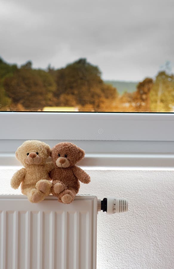 Teddy bears on radiator