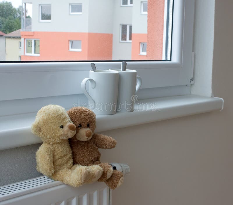 Teddy bears on radiator