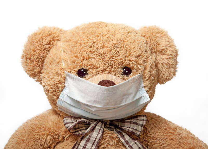 Teddybeer in een medisch masker stock fotografie Teddybeer in een medisch masker stock fotografie