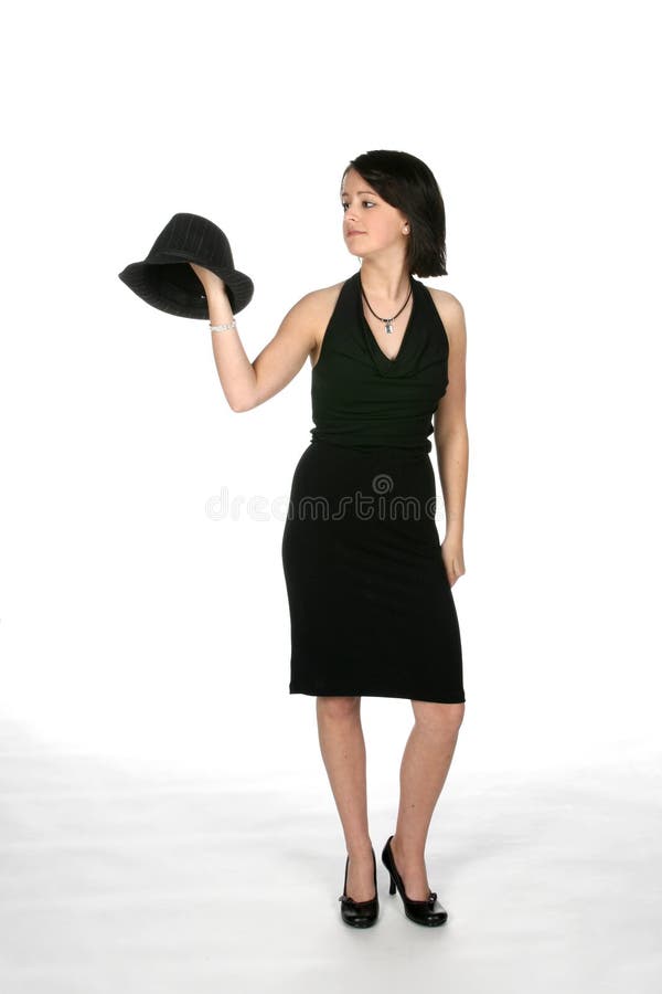 Teen in black dress with black top hat