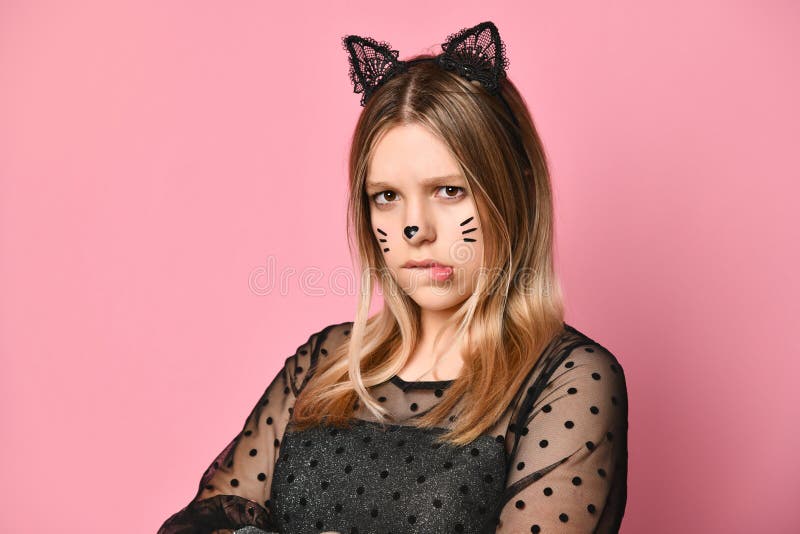 Adolescent in Black Dress, Headband Like Cat Ears, Face Painting. she  Posing on Pink Background. Close Up Stock Photo - Image of dress, emotions:  197805810