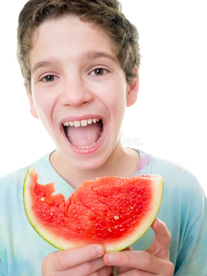 Teen Boy Eating a Slice of Watermelon Stock Ph