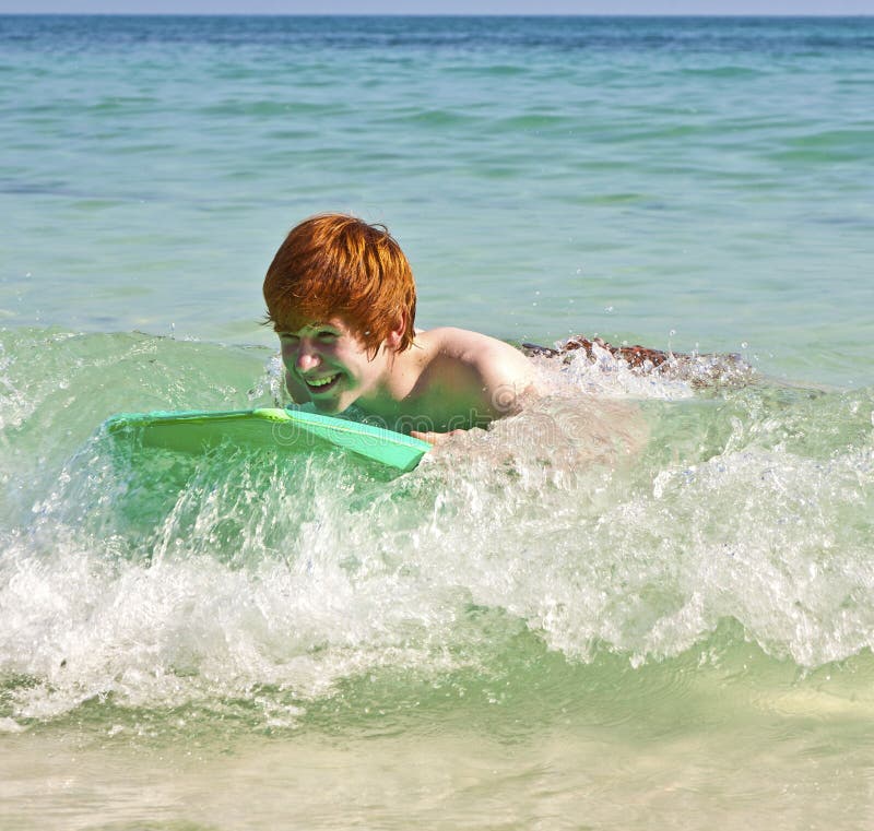 Teen boy enjoys his vacation by the sea