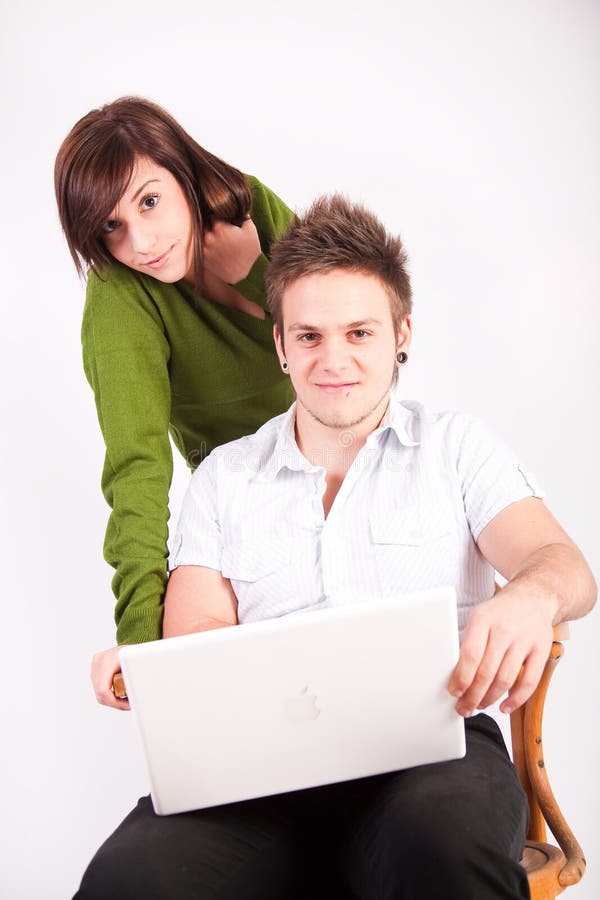 Teen boy and girl with laptop