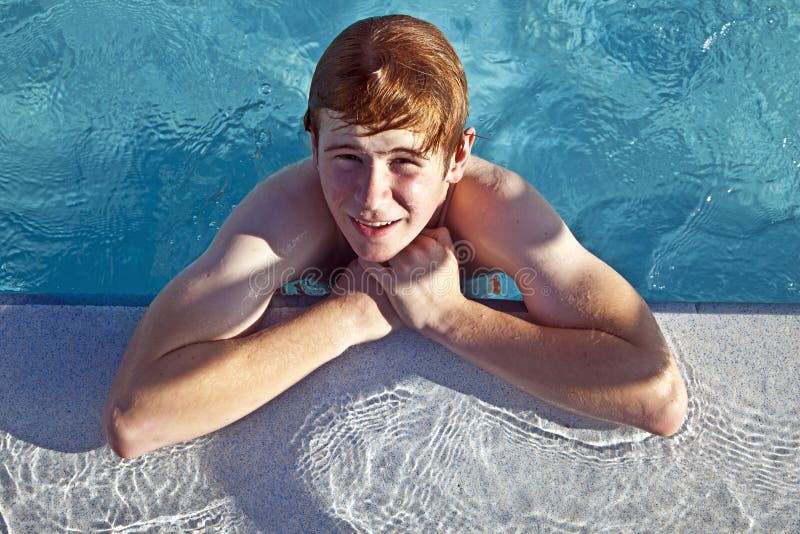 Teen boy has fun in the pool