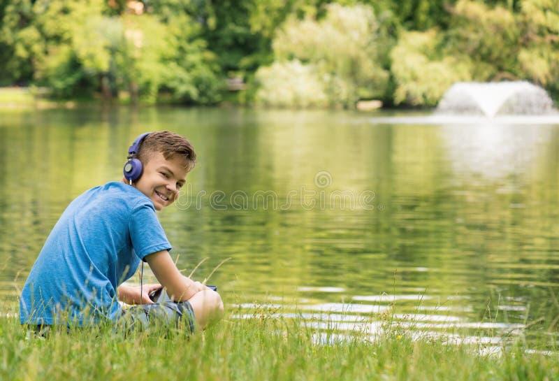 Teen boy with water Stock Photo by ©VaLiza 116935330