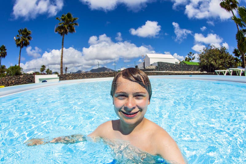 Happy Little Boy Swimming In The Pool Stock Photo 