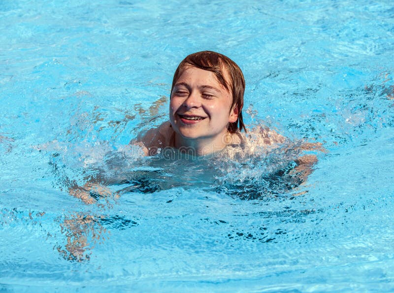 Teen Boy Swimming In The Pool Stock Photo - Image of 