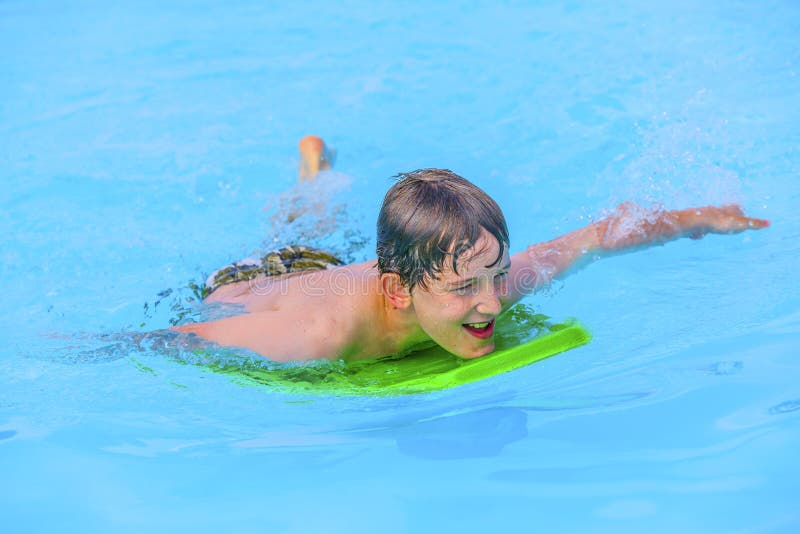 Teen Boy Swimming In The Pool Royalty Free Stock Photo 
