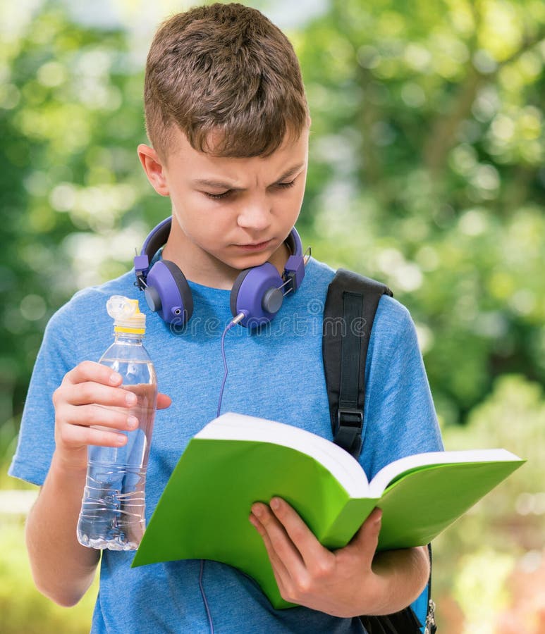 Teen boy with water, Stock image