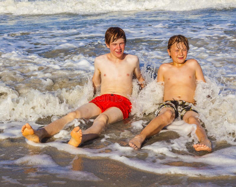 Teen boys have fun during seaside holiday stock photos Teen boys have fun during seaside holiday stock photos