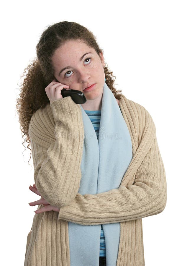 A cute teen girl talking on the cellphone, having a boring conversation. Isolated. Boring kid white stock images, royalty-free photos and pictures