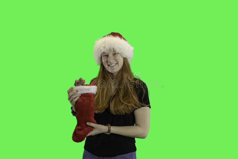 Teen with Christmas stocking green screen stock photos Teen with Christmas stocking green screen stock photos