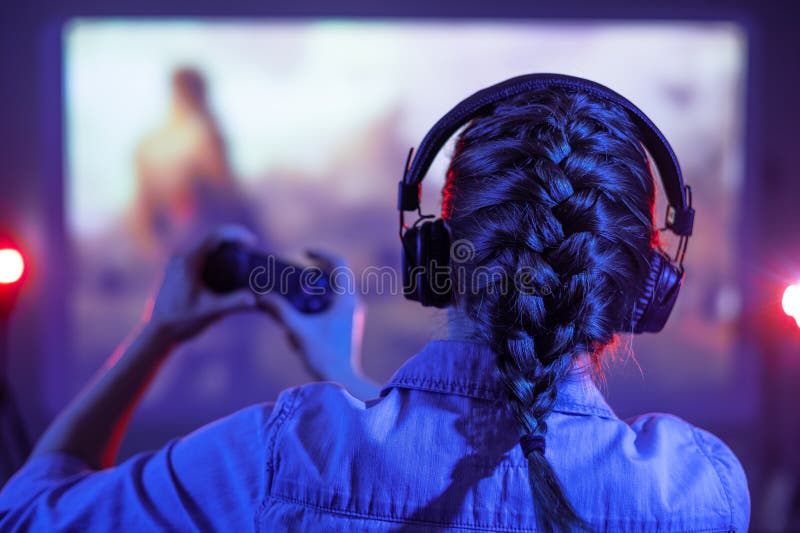 Free Photo  Person playing video games with controller on computer. player  using joystick and wearing headphones to play online game on monitor.  modern man using gaming equipment to have fun.