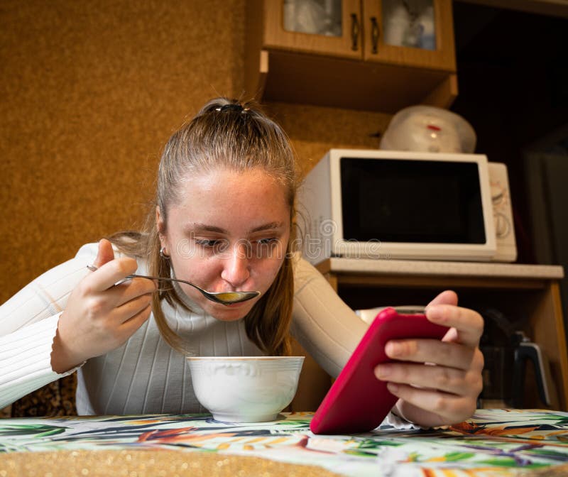 Teen Girl Eating Breakfast In The Kitchen Stock Image Image Of Woman Indoors 200598999