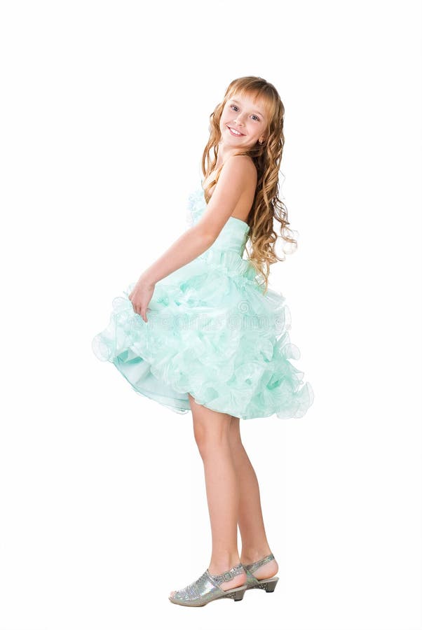 Teen girl in fancy gown dancing isolated royalty free stock photo