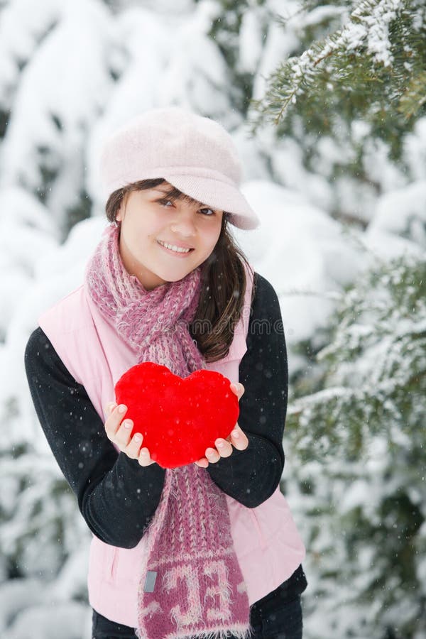 Teen girl heart in his hands