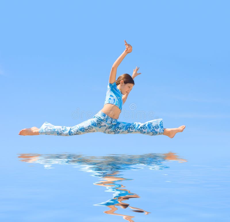 Teen Girl jump on blue background