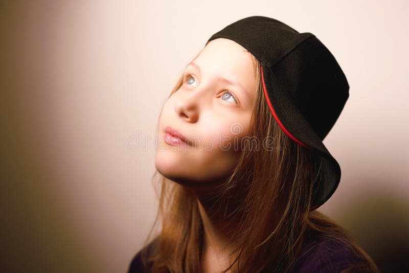 Teen girl looking up and smiling