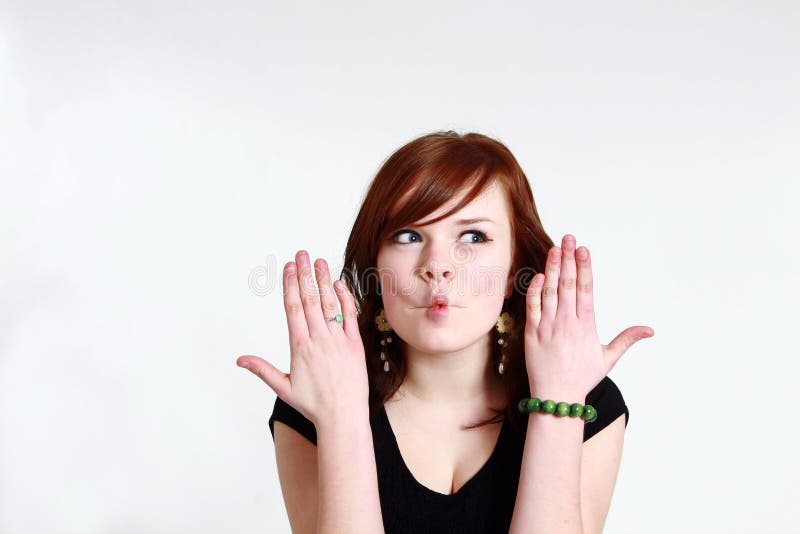 Teen girl making a fish face royalty free stock photos