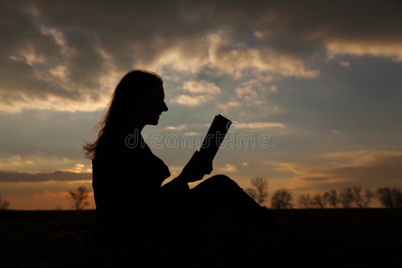 young girl reading silhouette