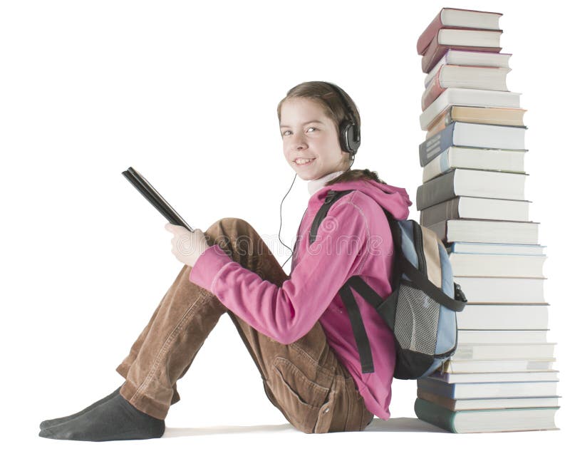 Teen girl reads ebook near the stack of books