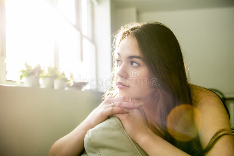 A Teen Girl Relaxing on the Sofa at Home Stock Photo - Image of jeans ...