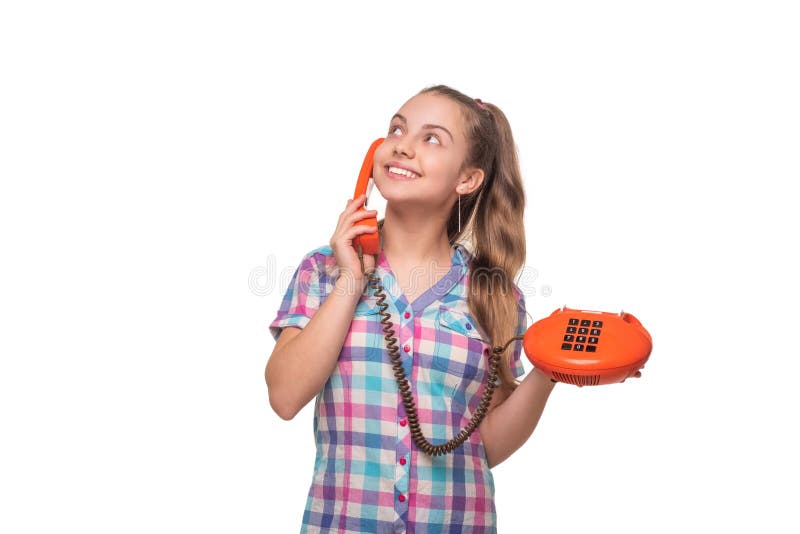 Teen girl with retro phone isolated on white. Nostalgia concept. Retro rotary telephone technology. Girl having a phone royalty free stock photos