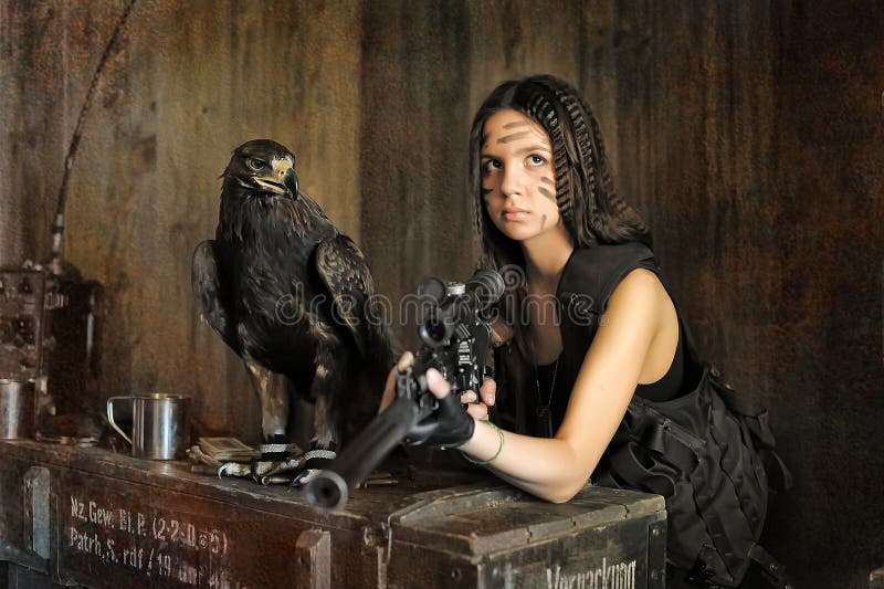 Teen girl with a rifle stock photo