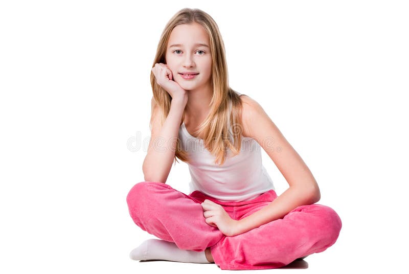 Teen girl sitting isolated on white