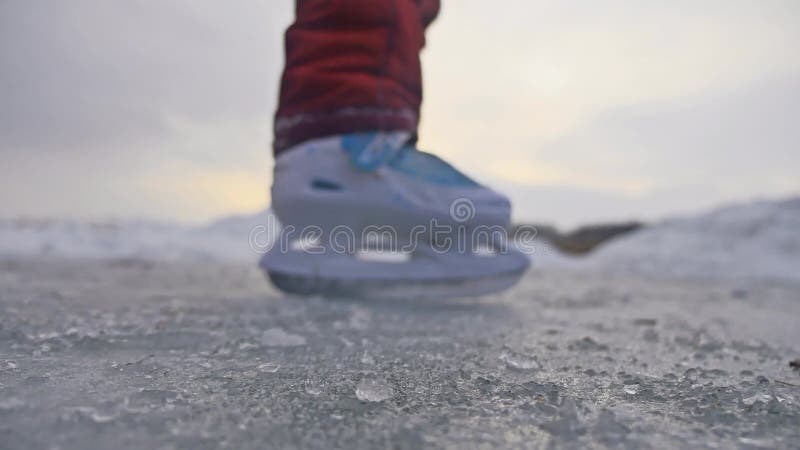 Teen girl skating on ice, winter sunset beautiful view, holidays winter