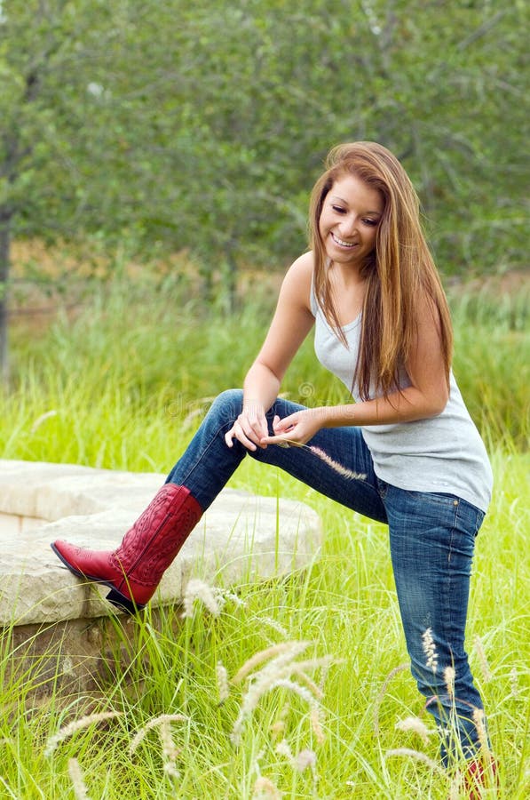 Teen Girl Wearing Jeans and Cowboy Boots Stock Image - Image of girl ...