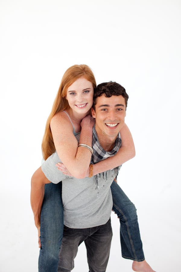 Teen giving his girlfriend piggyback ride. 