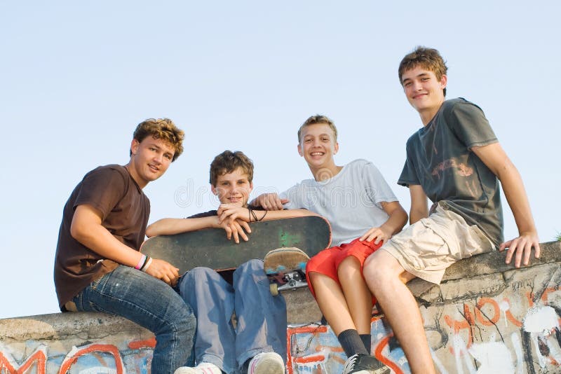 Group of teen boys playing outdoors. Group of teen boys playing outdoors