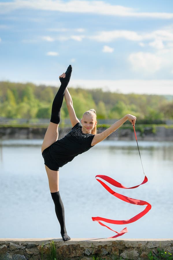 Teen Gymnast Doing Vertical Split royalty free stock photography Teen Gymnast Doing Vertical Split royalty free stock photography