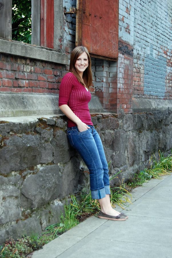 Teen Leaning Against Wall - Vertical, Smiling