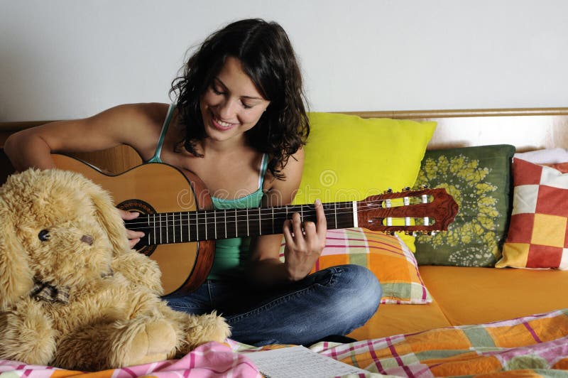 Teen playing guitar