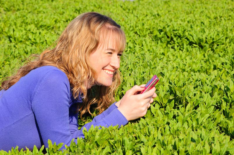 Teen reads sms and smiles