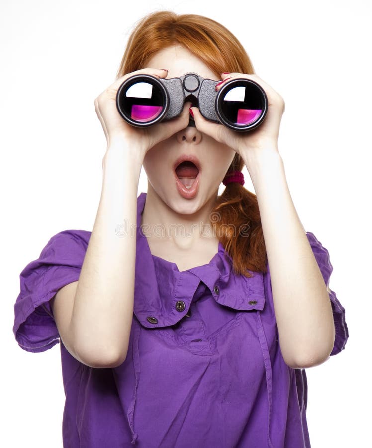 Teen red-haired girl with binoculars