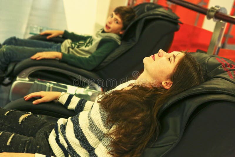 Teen Siblings Brother and Sister in Massage Chair Stock Photo Image