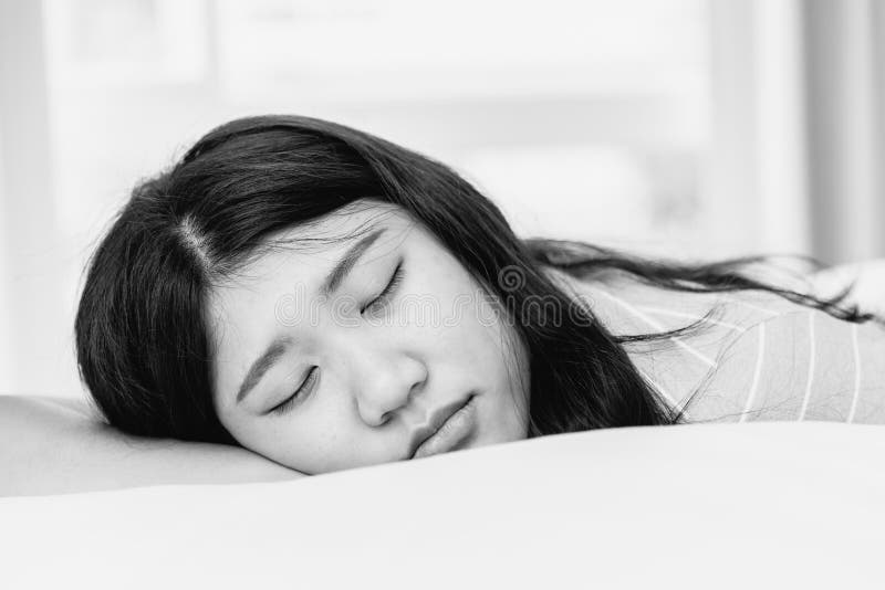 Teen sleeping black and white monotone