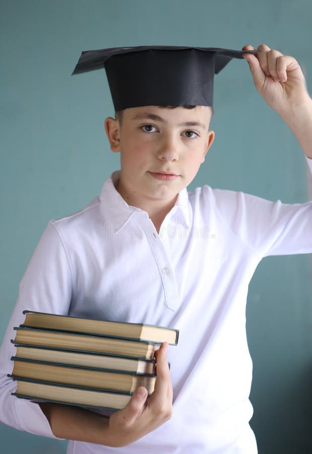 Teen Student Boy In Graduation Cap With Books Pile Stock Image Image