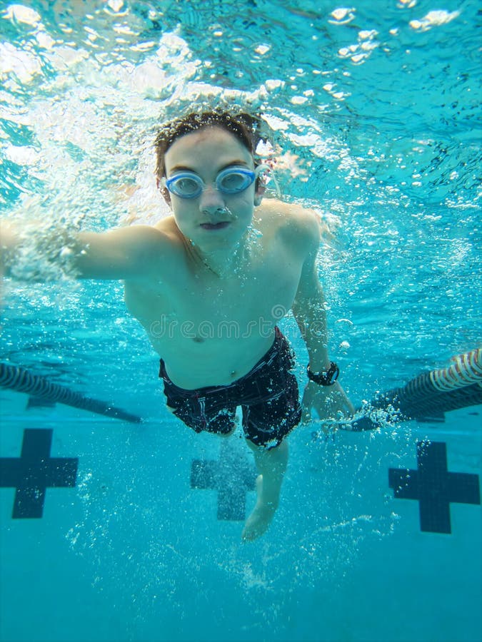 Teen swimming freestyle