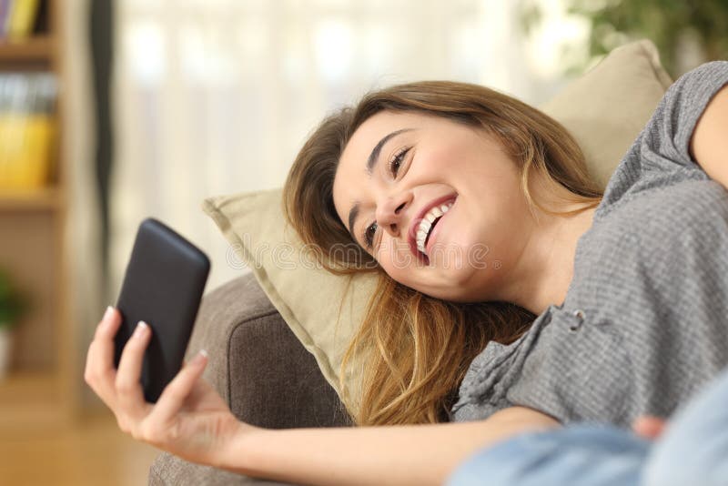 Teen Watching Videos Smart Phone Home Stock Photos image pic