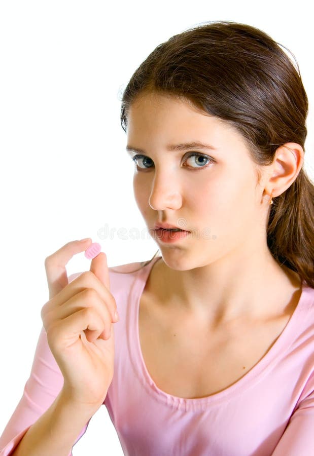 Lovely teen girl in pink with pill. Lovely teen girl in pink with pill