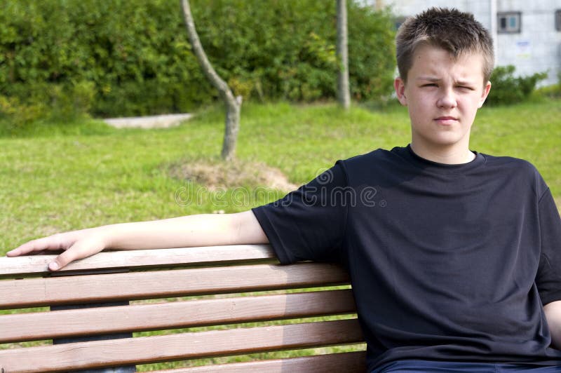 Teenage boy on bench