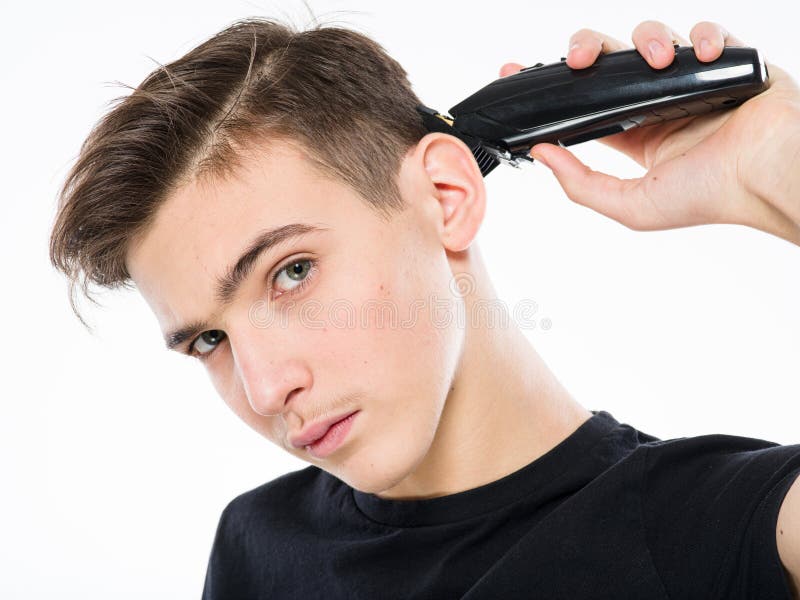 Teenage Boy Cuts His Own Hair with an Electric Razor. Young Man Cuts His  Hair with a Razor Stock Image - Image of shaver, electric: 188598589