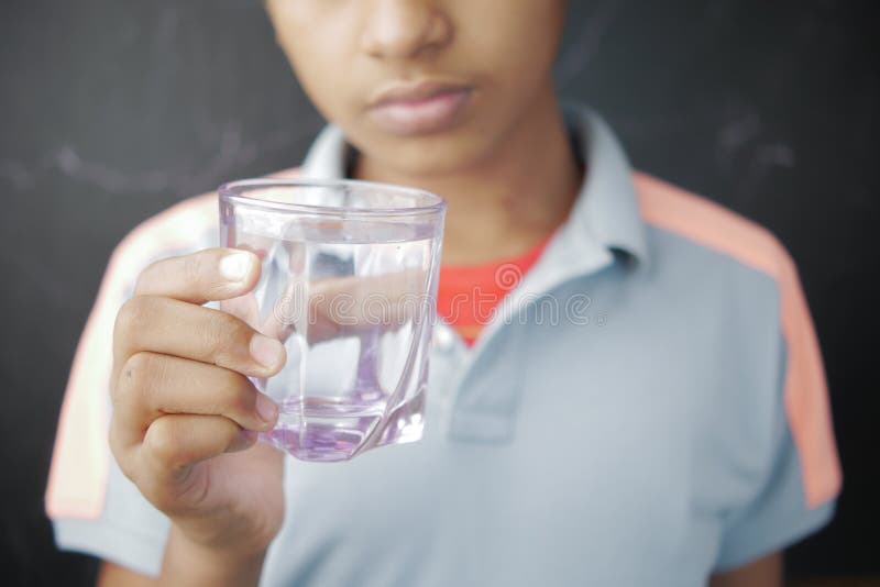 Teen boy with water Stock Photo by ©VaLiza 116935330