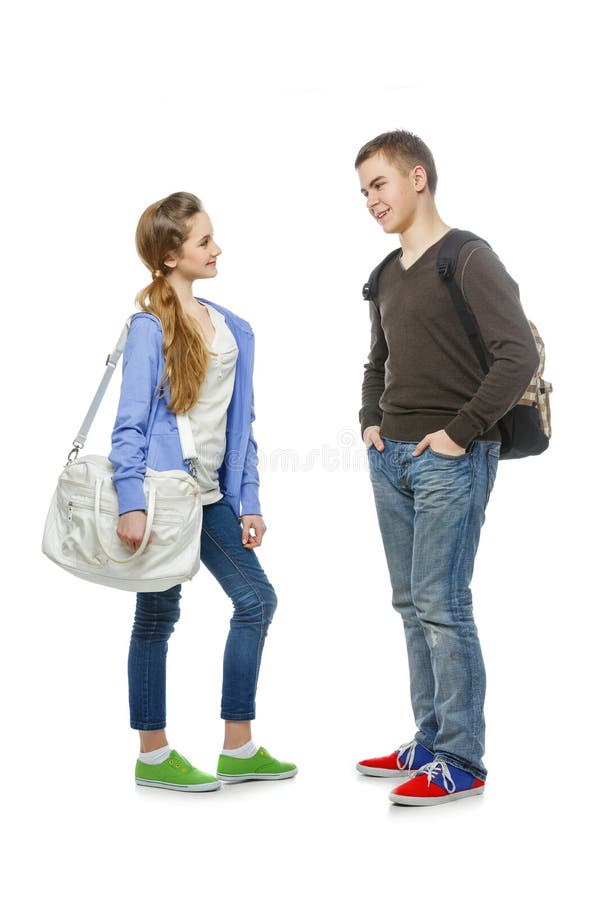 Teenage boy and girl isolated on white