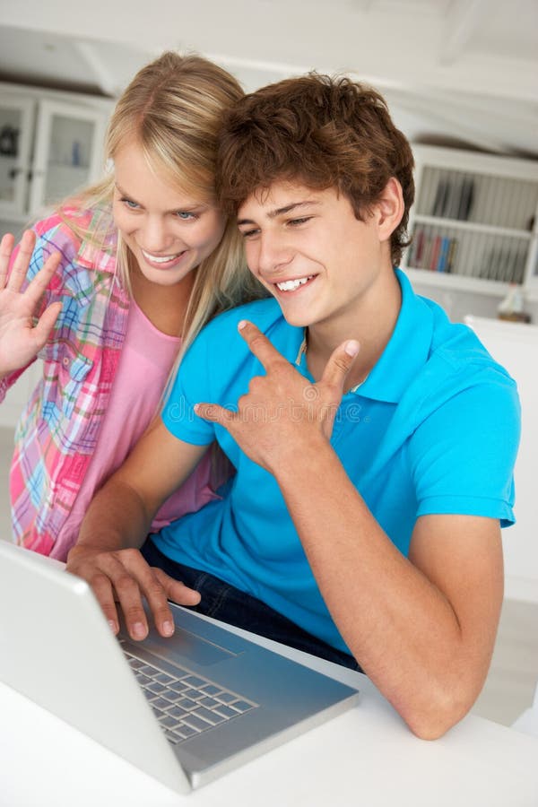 Teenage Boy And Girl On Laptop Stock Photo Image Of Home